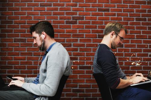 Colleagues facing away from each other