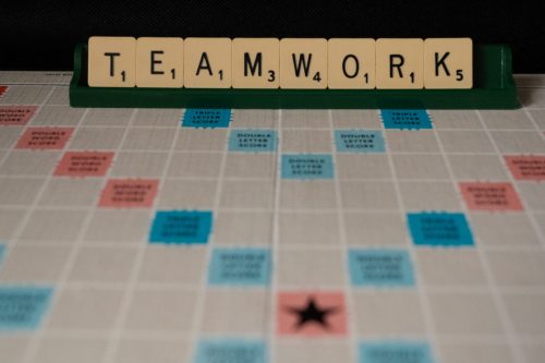 scrabble-board-with-tiles-that-spell-out-teamwork