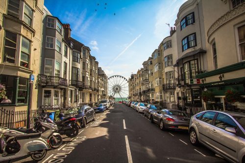 shot-of-brighton-promenade-with-a-ferris-wheen-at-the-end