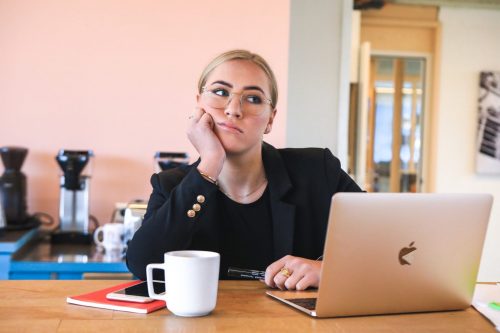 woman-in-business-clothes-looking-bored-working-from-home