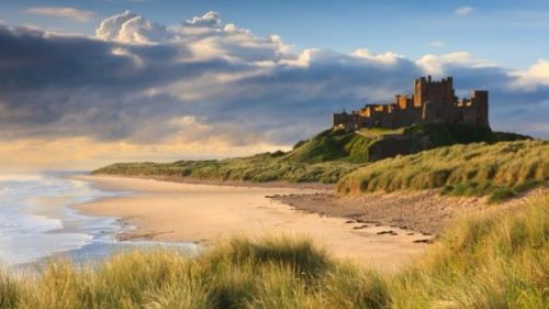 a-shot-of-a-northumberland-coast-and-a-castle-in-the-distance