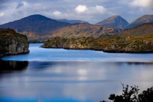a-shot-of-crystal-blue-waters-and-mountains-in-killarney-ireland
