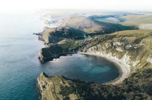 an-aerial-shot-of-a-jurassic-coast-cove-in-england