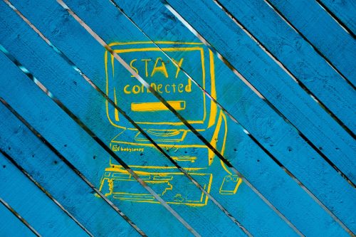 image-of-blue-decking-and-a-painted-on-image-of-a-computer-saying-Stay-Connected-on-the-screen