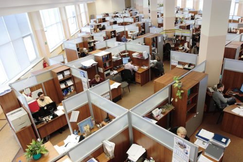 overhead-shot-of-a-huge-office-space-with-cubicles-and-very-little-free-space