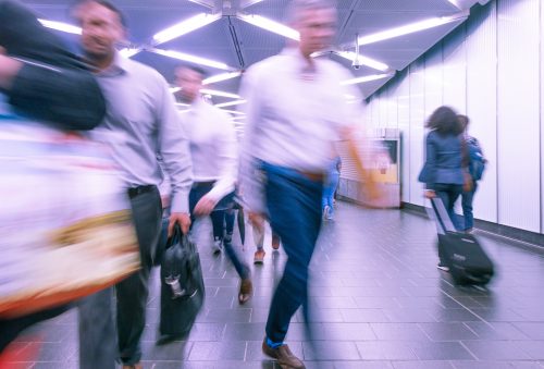 shot-of-businesspeople-moving-through-terminal-with-blurry-appearance-to-show-movement