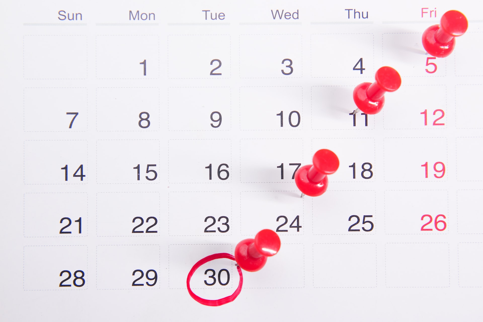 image-of-a-calendar-with-red-pins-in-four-of-the-days