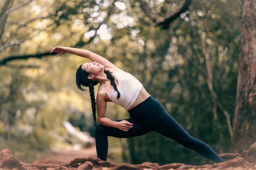 woman-stretching-in-a-forest