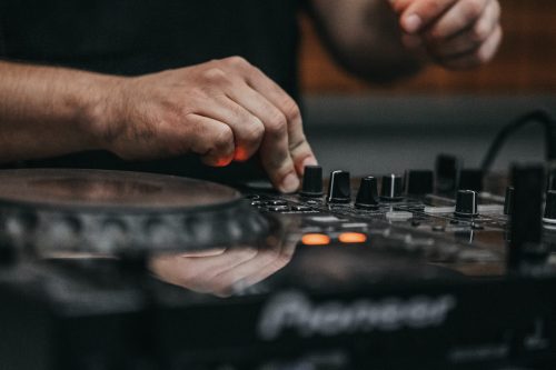 close-up-image-of-a-dj-playing-the-decks