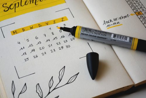 image-of-a-calendar-with-a-yellow-highlighter-sat-on-top