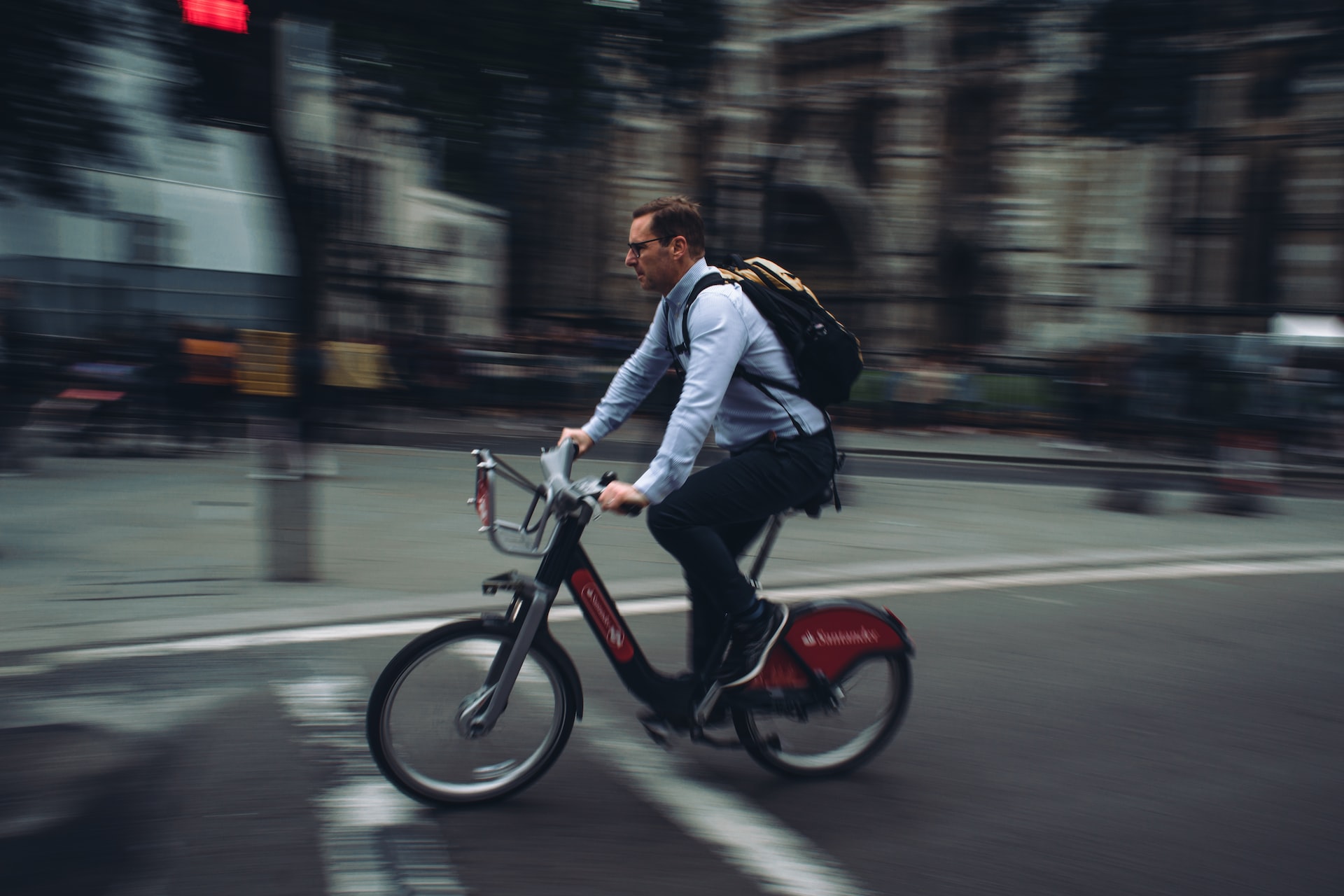 man-cycling-through-a-busy-street-on-his-way-to-work