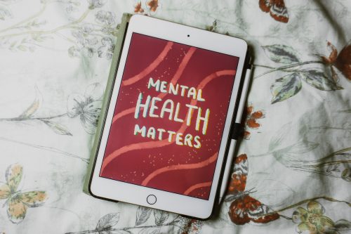 shot-of-a-tablet-on-a-bed-with-the-words-mental-health-matters-on-the-screen