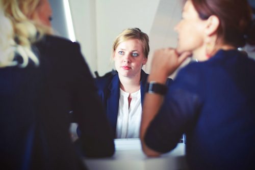 woman-in-an-interview-between-two-hiring-managers