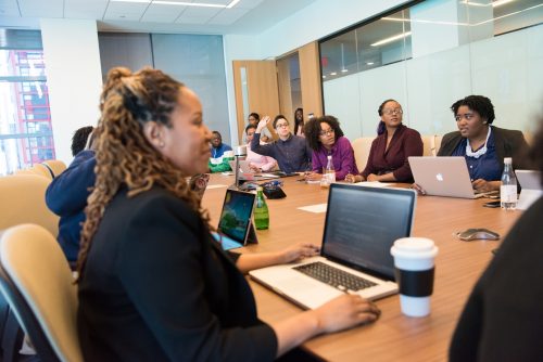 shot-of-a-group-of-people-in-a-meeting-around-a-conference-table