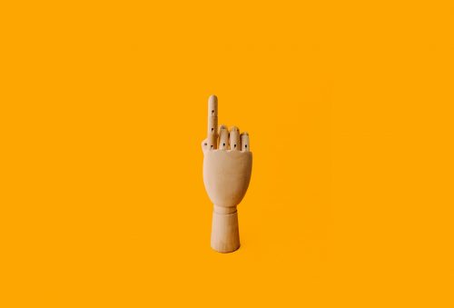 image-of-a-wooden-puppet-hand-with-index-finger-pointing-up