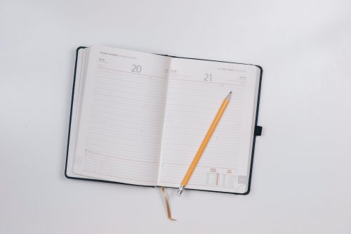 image-of-a-notebook-planner-open-with-a-pencil-resting-on-top