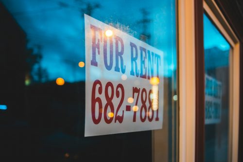 shot-of-a-sign-in-a-window-advertising-a-space-for-rent