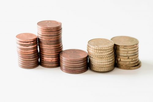 shot-of-five-coin-stacks-of-differing-height